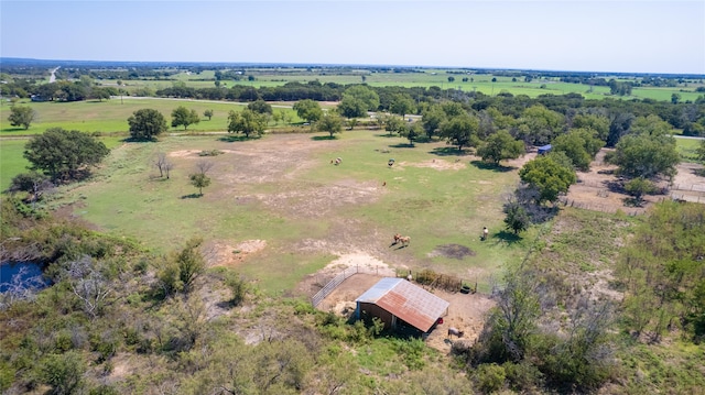 birds eye view of property with a rural view