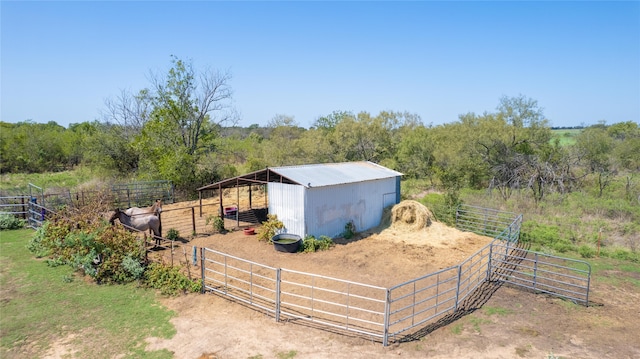 view of outbuilding featuring a rural view