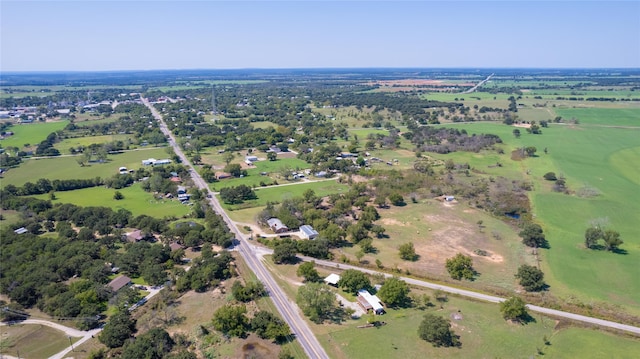 birds eye view of property with a rural view