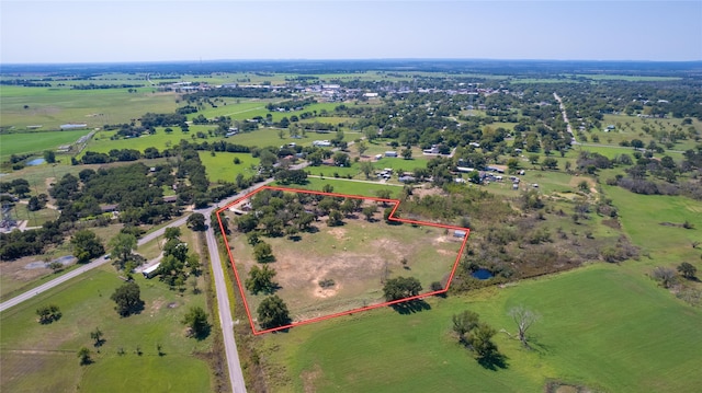 birds eye view of property with a rural view