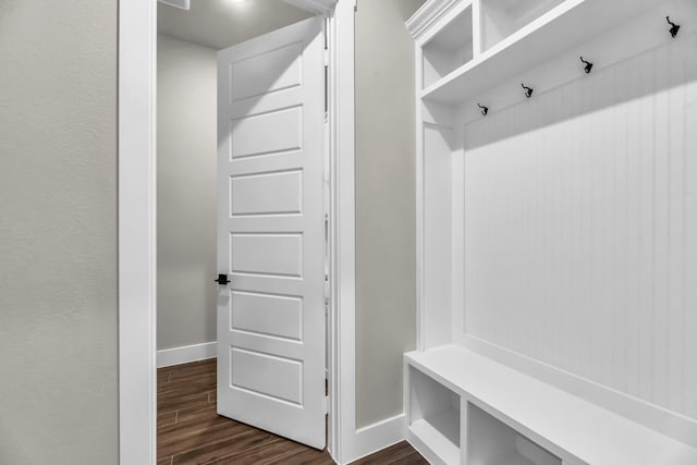 mudroom with dark hardwood / wood-style floors