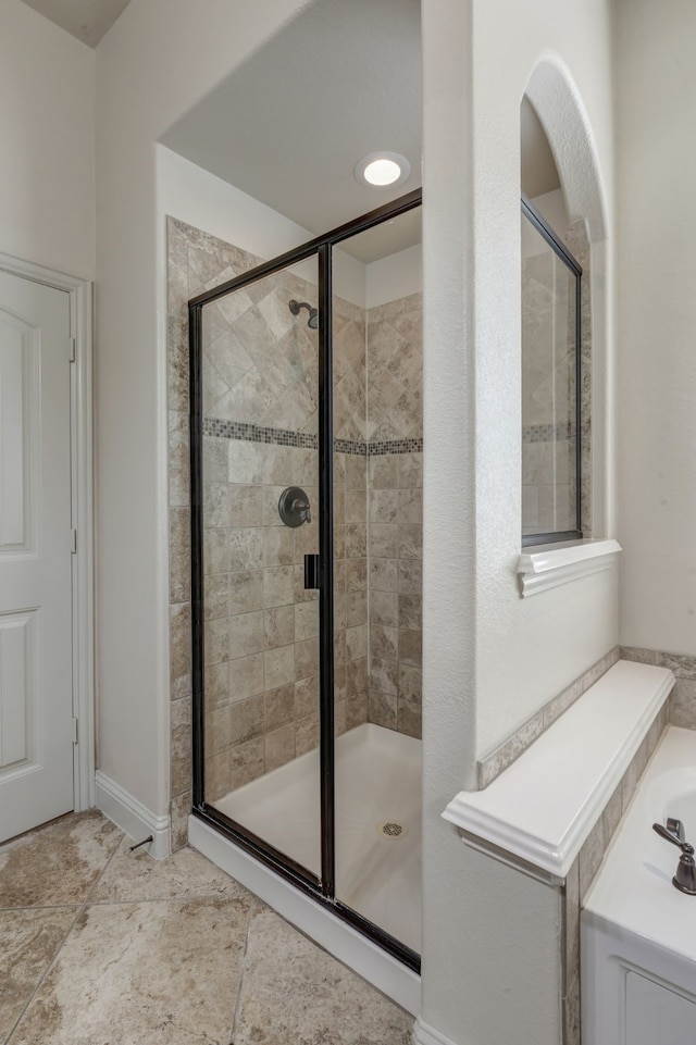 bathroom featuring plus walk in shower