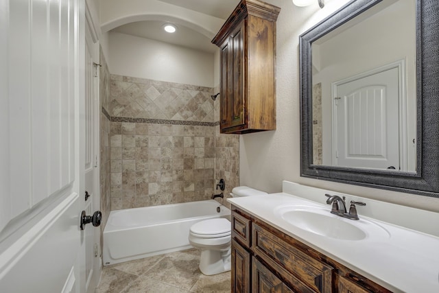 full bathroom featuring vanity, toilet, tile patterned floors, and tiled shower / bath