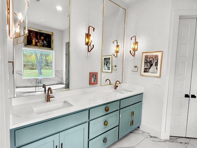 bathroom featuring vanity and a tub