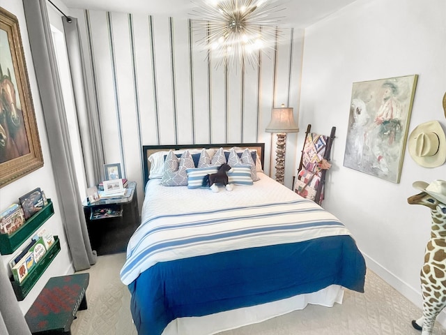 bedroom with light colored carpet and a notable chandelier