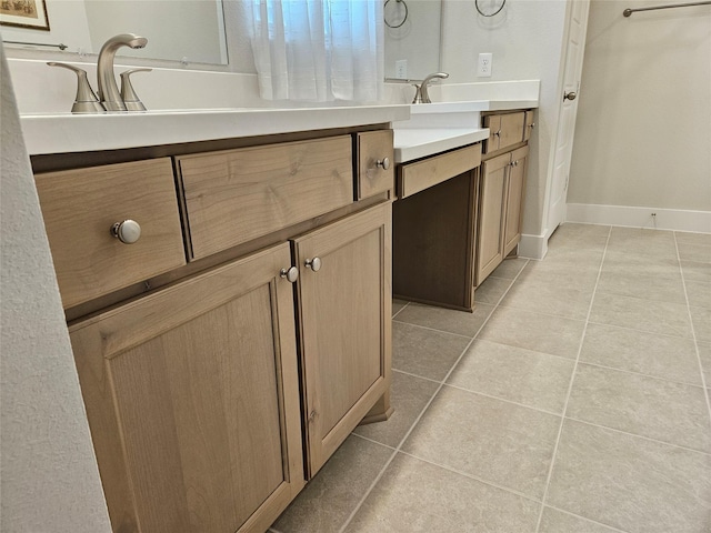 bathroom featuring tile patterned floors and vanity