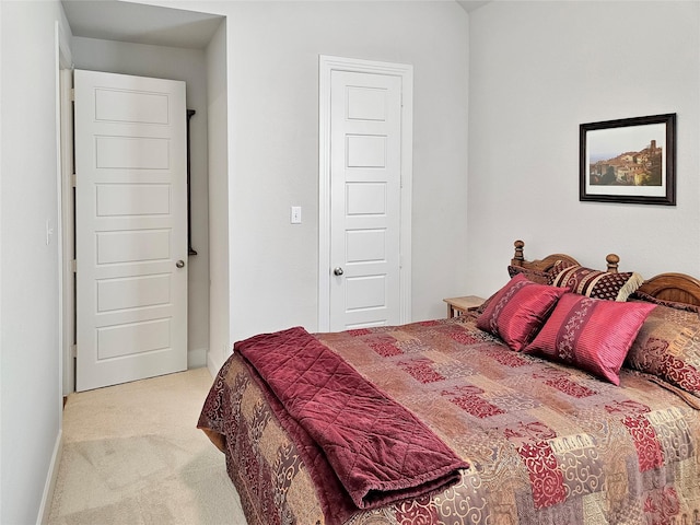 bedroom with light colored carpet