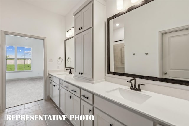 bathroom featuring tile patterned flooring and vanity