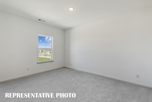 empty room featuring carpet flooring