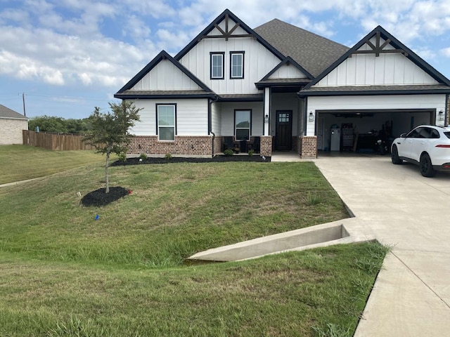 view of front facade featuring a garage and a front lawn