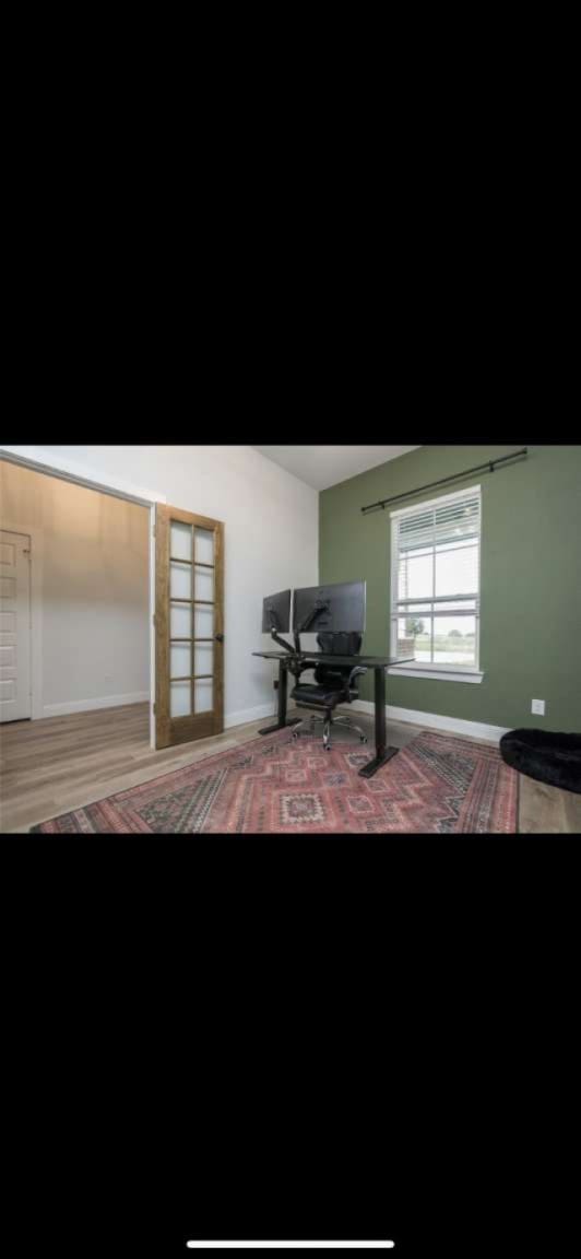 bedroom with hardwood / wood-style flooring