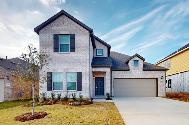 view of front facade with a front lawn and a garage