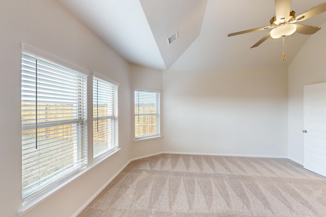 carpeted spare room with lofted ceiling and ceiling fan