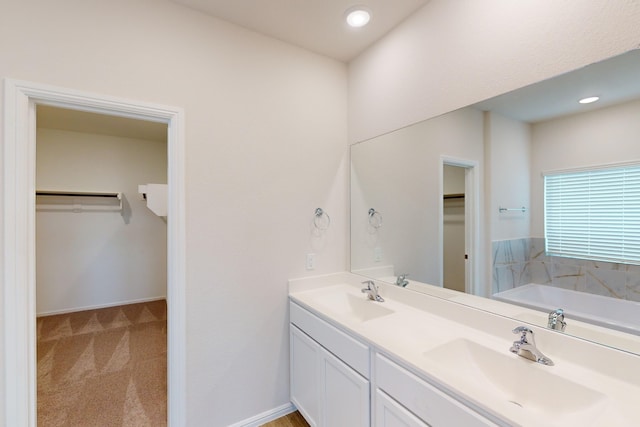 bathroom with a bath and vanity