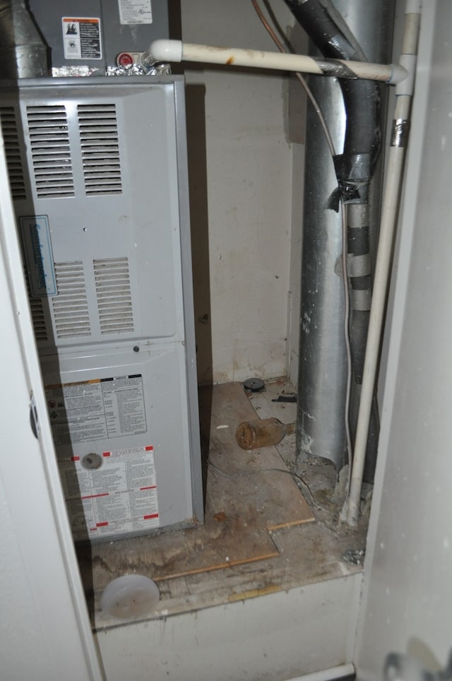 utility room with heating unit