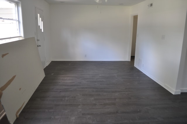 interior space with dark wood-type flooring and ceiling fan