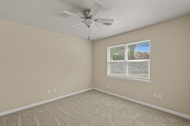 empty room featuring carpet and ceiling fan