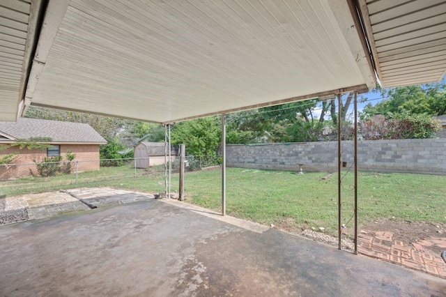 view of patio featuring a shed