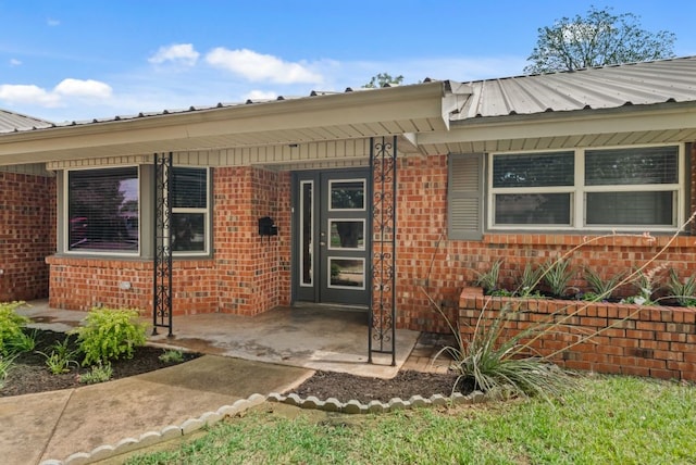 property entrance with a patio