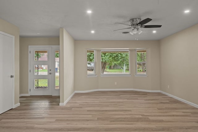 foyer entrance featuring ceiling fan and light hardwood / wood-style flooring