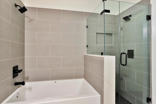 bathroom with separate shower and tub