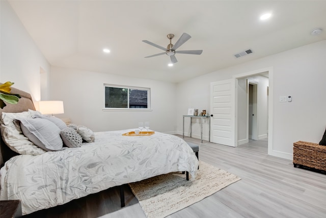 bedroom with light wood-type flooring and ceiling fan