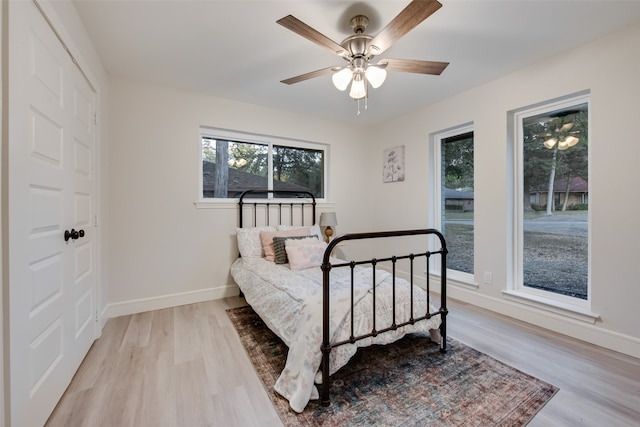 bedroom featuring ceiling fan and light hardwood / wood-style flooring