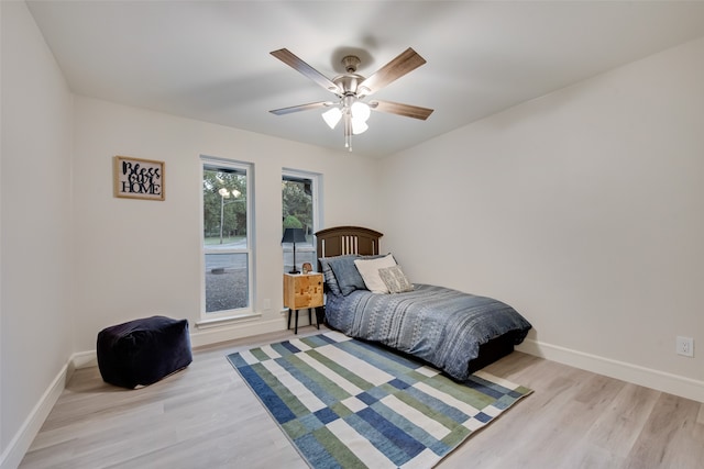 bedroom featuring ceiling fan and light wood-type flooring