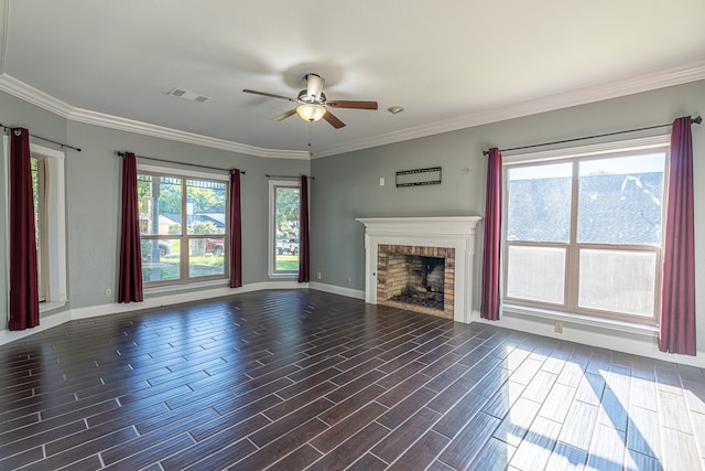 unfurnished living room featuring ceiling fan, ornamental molding, a fireplace, and dark hardwood / wood-style flooring