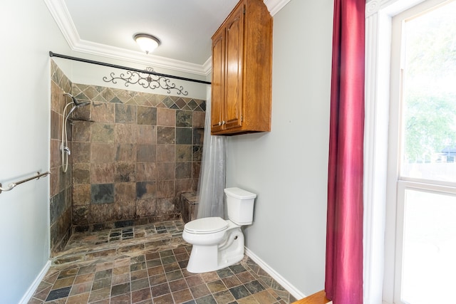 bathroom featuring curtained shower, ornamental molding, and toilet