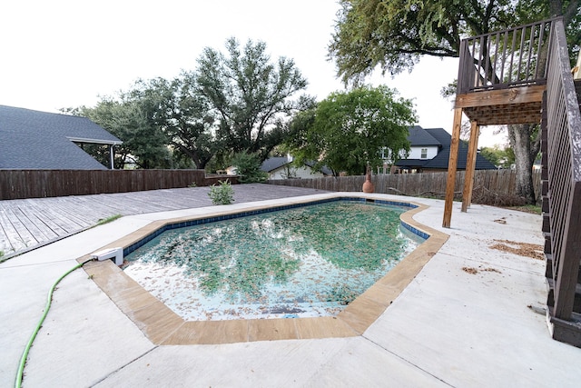 view of swimming pool featuring a deck