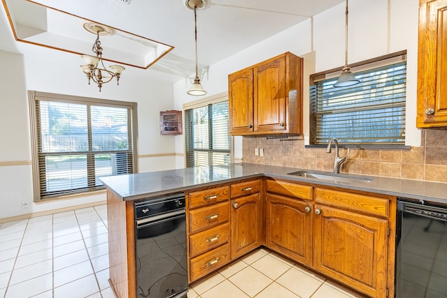 kitchen featuring pendant lighting, tasteful backsplash, and sink