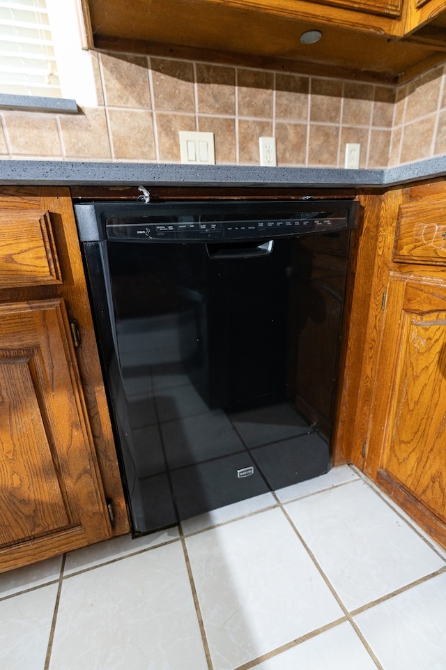 room details with light tile patterned flooring and dishwasher