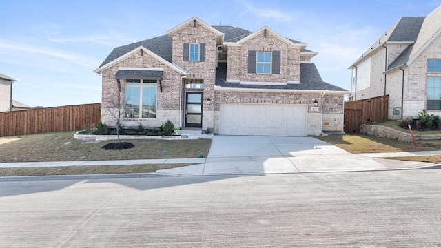 view of front facade featuring a lawn and a garage