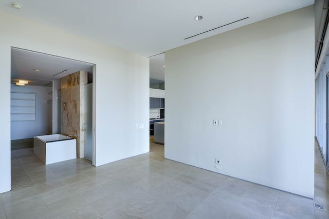 empty room with light tile patterned flooring