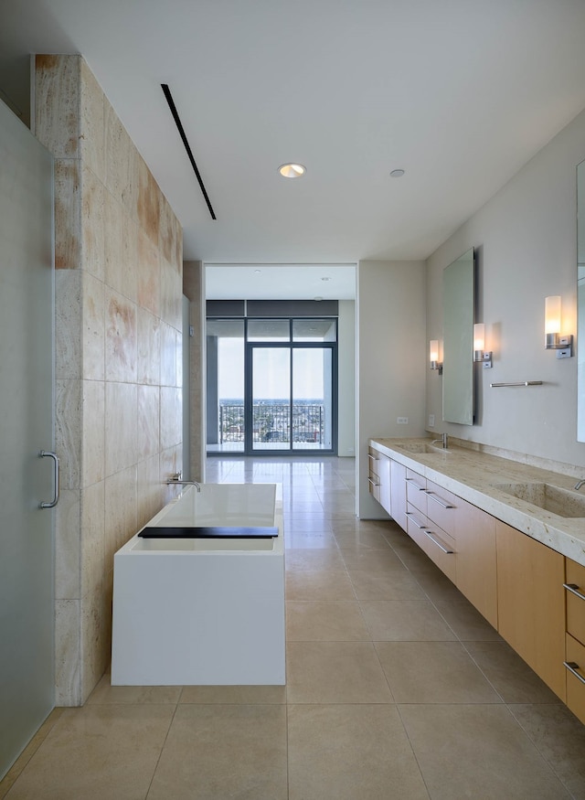 bathroom featuring floor to ceiling windows, tile walls, vanity, plus walk in shower, and tile patterned floors