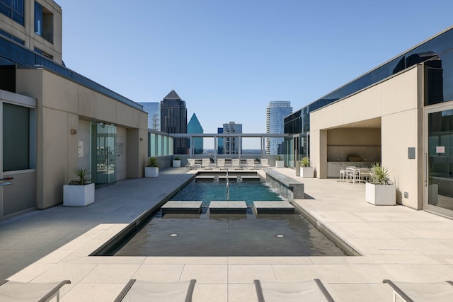 view of swimming pool with a patio area