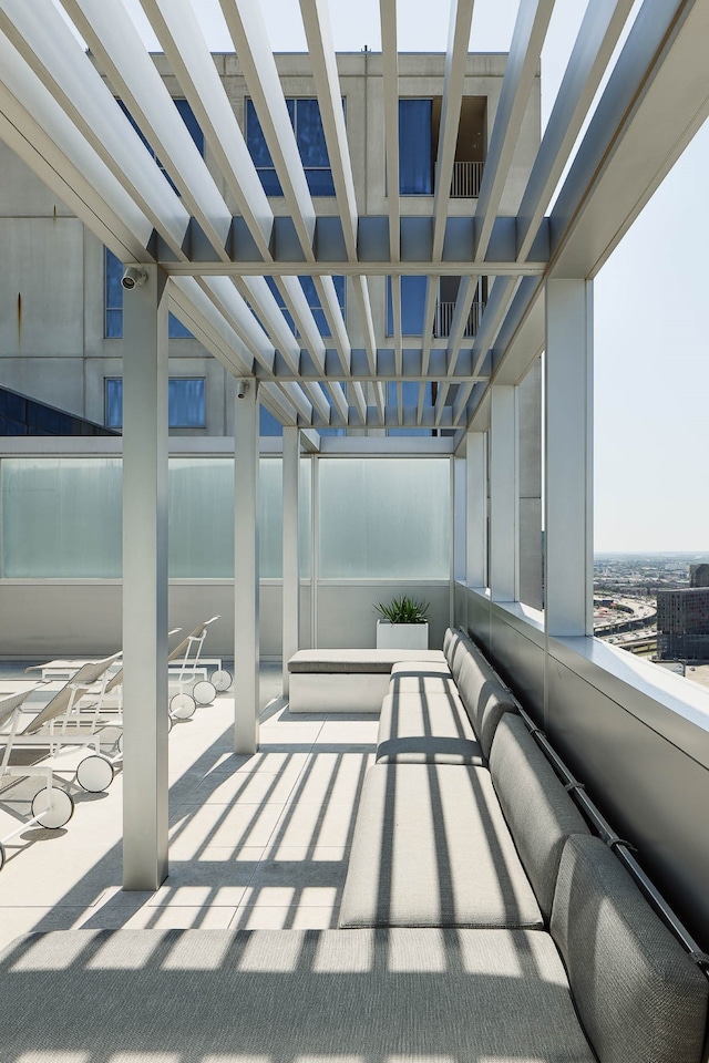 view of patio featuring a balcony