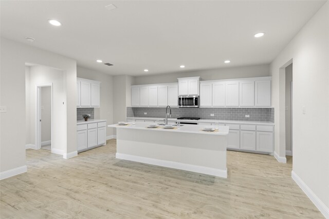 interior space featuring lofted ceiling and light carpet