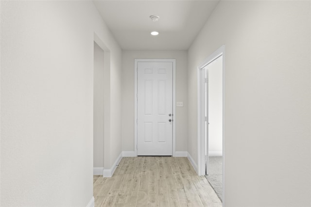 corridor featuring light hardwood / wood-style floors