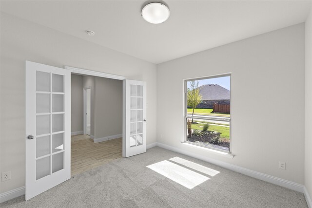 unfurnished living room featuring ceiling fan, a fireplace, and light hardwood / wood-style floors