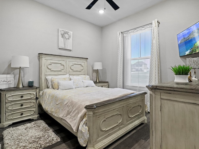 bedroom featuring dark hardwood / wood-style floors and ceiling fan