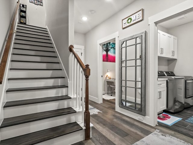 staircase featuring wood-type flooring and washing machine and clothes dryer