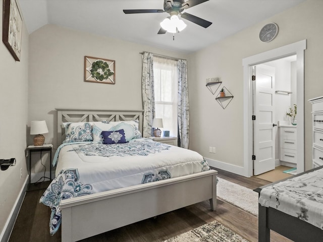 bedroom featuring wood-type flooring, vaulted ceiling, and ceiling fan