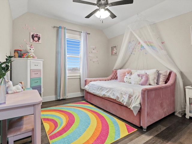 bedroom with ceiling fan, dark hardwood / wood-style floors, and vaulted ceiling