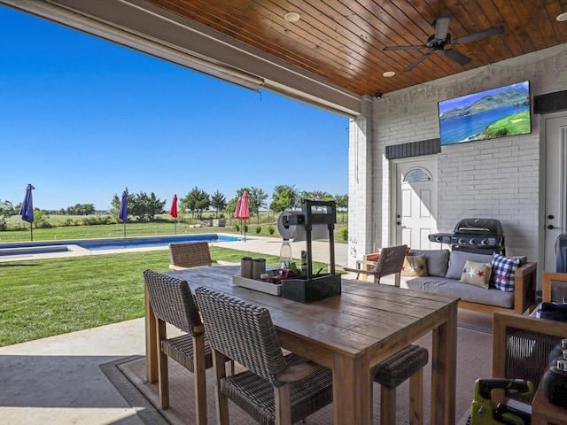 view of patio with ceiling fan and outdoor lounge area