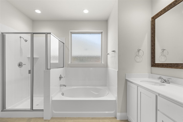 bathroom featuring vanity and plus walk in shower