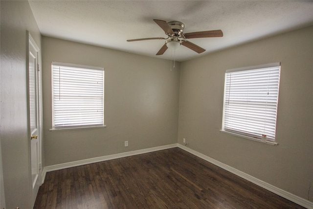 unfurnished room featuring dark hardwood / wood-style floors and ceiling fan