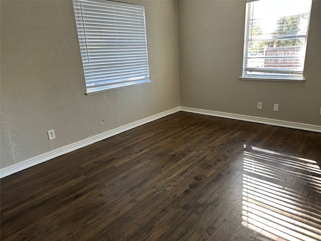 empty room featuring dark hardwood / wood-style floors