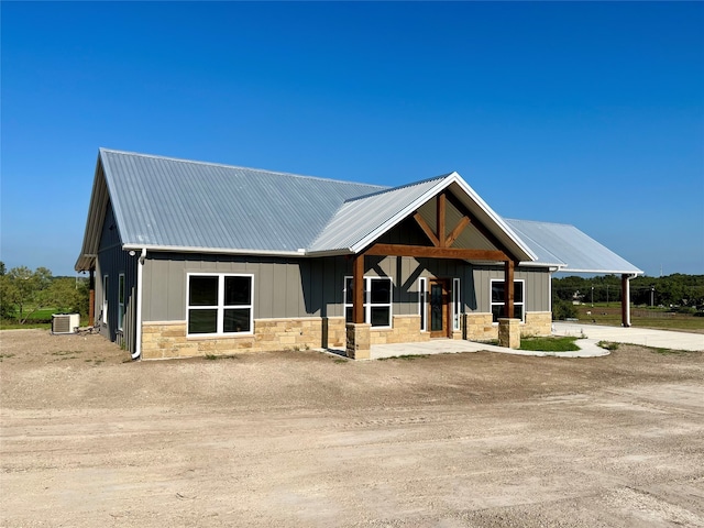 view of front of house featuring cooling unit